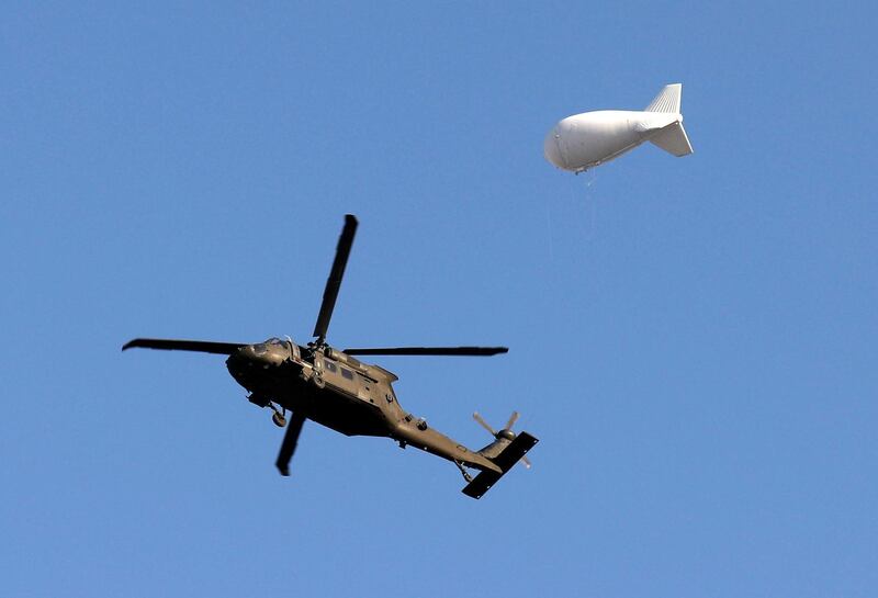 A NATO helicopter flies over the Resolute Support headquarters in Kabul, Afghanistan November 3, 2018.REUTERS/Mohammad Ismail