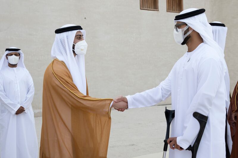 Sheikh Zayed bin Hamdan bin Zayed (R) greets Sheikh Zayed bin Mansour bin Zayed at the wedding.