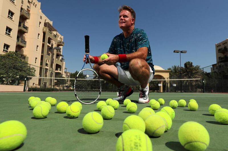 Adrian Wells who lost his job in Dubai in the pandemic turned his hand to tennis coaching and art and said his life has never been better in Remraam, Dubai on April 21st, 2021. Chris Whiteoak / The National. 
Reporter: Nick Webster for News
