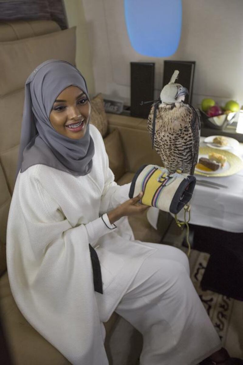 Halima Aden poses with a falcon at Etihad Airways launch of Runway to Runway rewards programme. Courtesy Etihad Airways