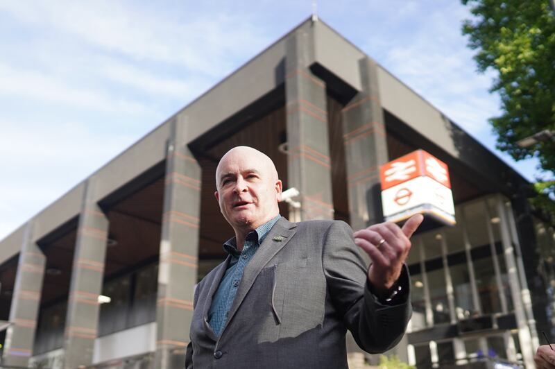 RMT leader Mick Lynch on a picket line outside Euston station. PA