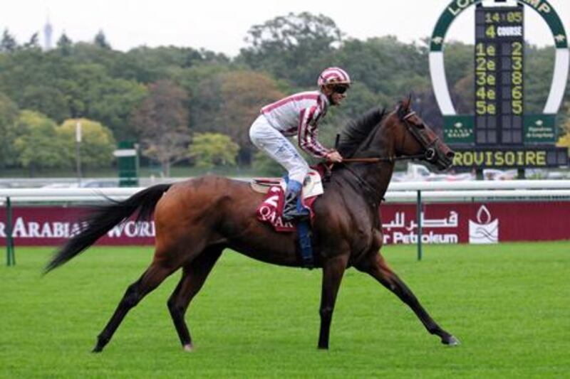 Olivier Peslier rides Cirrus Des Aigles to victory in the Qatar Prix Dollar at Longchamp.