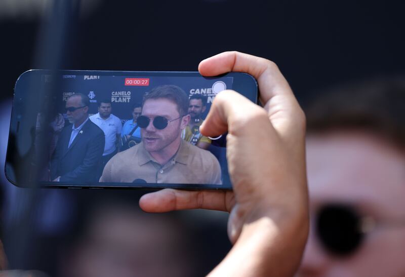 Canelo Alvarez is seen in a iPhone before a press conference. AFP