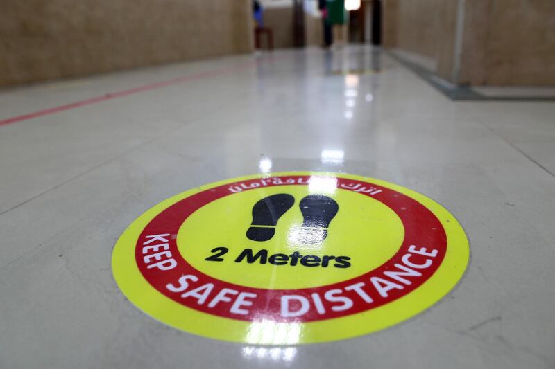 SHARJAH, UNITED ARAB EMIRATES , September 24 – 2020 :- 2 meters distance stickers pasted on the floor as a Covid 19 safety measure at the Victoria English School in Sharjah. New Covid safety setup in different areas of the school such as hand sanitizer, safety message, social distancing stickers pasted on the floor, disinfection tunnels installed at all the gates of the school. Schools in Sharjah are opening on 27th September.  (Pawan Singh / The National) For News. Story by Salam