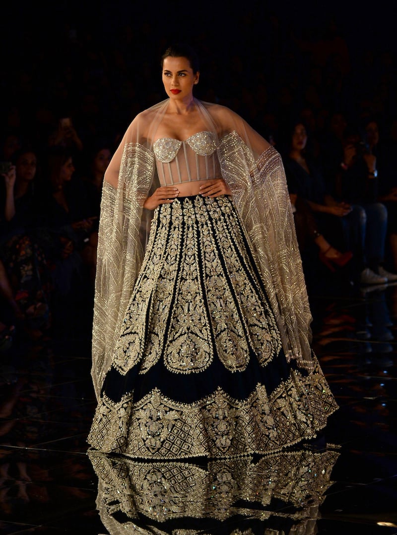Malhotra said that since there was so much going on in the collection - embroidery, pearl work and sequins plus reinvented can-cans, some monochromatic looks were introduced to offset the drama. AFP