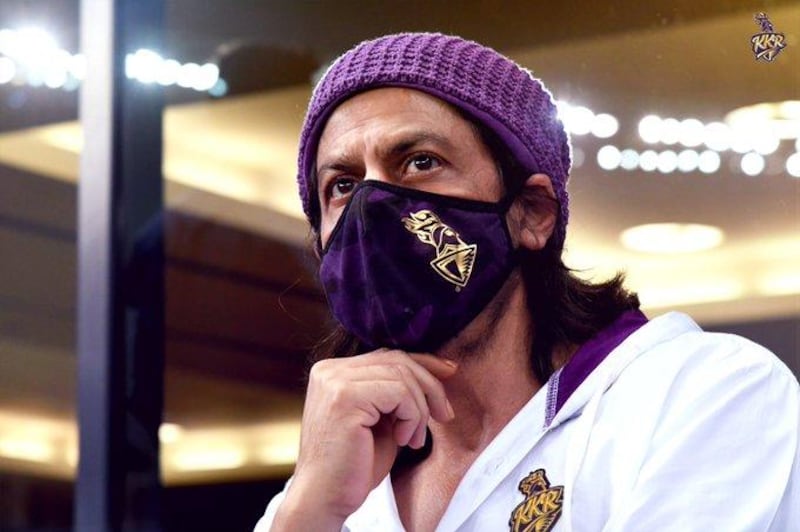 Bollywood hero Shah Rukh Khan wears a facemask emblazoned with the team logo of Kolkata Knight Riders. Twitter / KKRiders