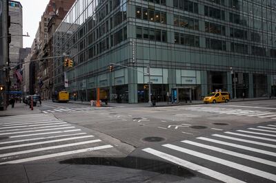 Empty streets are seen at the intersection in front of JPMorgan Chase & Co. bank branch on 6th Avenue and West 44th Street in New York, U.S., on Thursday, March 19, 2020. New York state Governor Andrew Cuomo on Thursday ordered businesses to keep 75% of their workforce home as the number of coronavirus cases rises rapidly. Photographer: Michael Nagle/Bloomberg