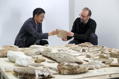 DUBAI, UNITED ARAB EMIRATES , Feb 16  – 2020 :-  Left to Right - Kenichi Teramoto  and Wael Al Awar showing the material collected for their Wetlands Project at the Al Serkal Avenue warehouse 47  in Dubai. (Pawan  Singh / The National) For Arts & Culture. Story by Razmig.