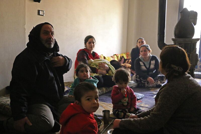 Members of seven displaced Syrian families gather in an apartment in the Kurdish Syrian town of Afrin on February 1, 2018 where they are all taking shelter after fleeing from a three-week assault by Turkey and allied Syrian rebels on towns and villages along the border in northern Syria.
The United Nations estimates that between 15,000 to 30,000 have been displaced by the Turkish-led offensive to other parts of Afrin district. 

 / AFP PHOTO / Ahmad Shafie BILAL