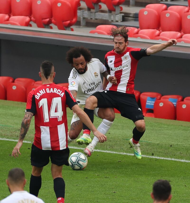 Real Madrid defender Marcelo vies for the ball with Athletic Bilbao's Iker Muniain at San Mames Stadium, in Bilbao.  EPA