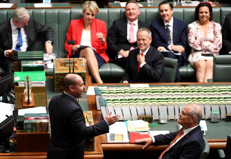 CANBERRA, AUSTRALIA - APRIL 04: Treasurer Josh Frydenberg speaks as the Opposition leader Bill Shorten and the Prime Minister Scott Morrison listen during Question Time in the House of Representatives at Parliament House on April 04, 2019 in Canberra, Australia. The Morrison governments first budget was released on Tuesday, delivering a surplus of $7.1bn, the first surplus in 12 years. Treasurer Josh Frydenberg has focused on tax cuts for middle income earners and 100 billion to be spent on infrastructure as well as increased spending on health, mental health, aged care and skills. (Photo by Tracey Nearmy/Getty Images)