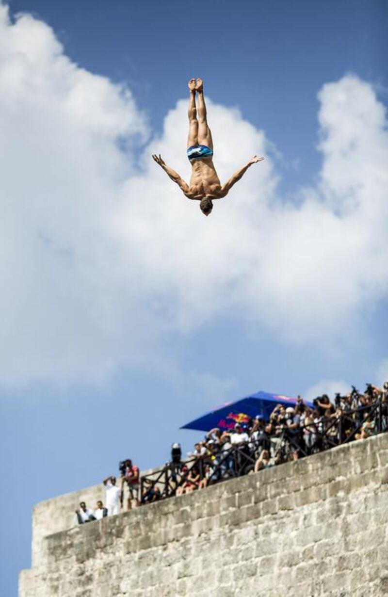 Michal Navratil of the Czech Republic dives from the El Morro lighthouse at Havana, Cuba on May 10, 2014. 