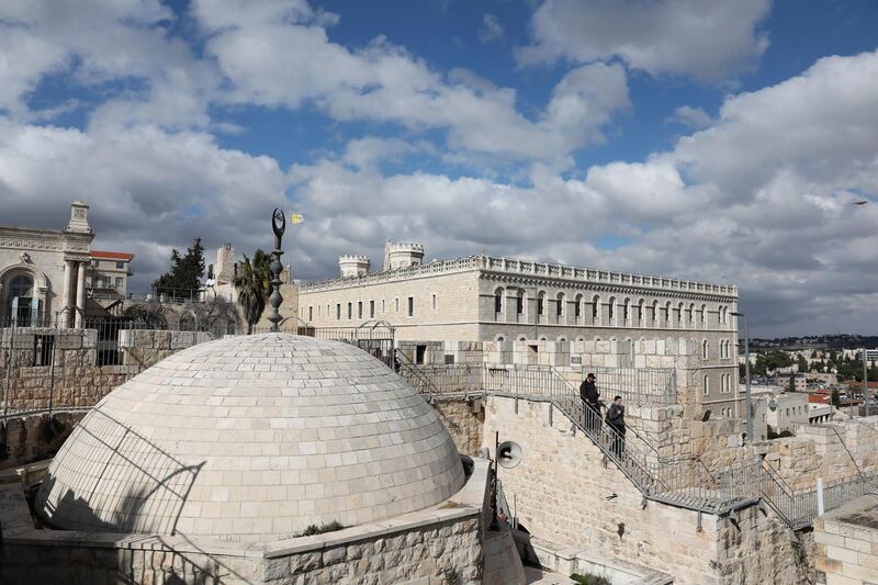 epa08213188 Tourists walk by the Christian Quarter at the  Walls Promenade on the walls of the Old City of Jerusalem, 12 February 2020. The Israeli East Jerusalem Development Authority has opened the Wall Promenade for tourists from the section leading over the Muslim Quarter from damascus gate to the Lions Gate . The Wall Promenade allows visitors to see a general view and the life within the crowded quarters of the Old City of Jerusalem  EPA/ABIR SULTAN