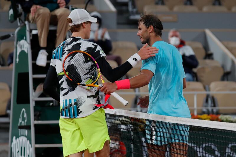 Italy's Jannik Sinner congratulates Rafael Nadal. AP
