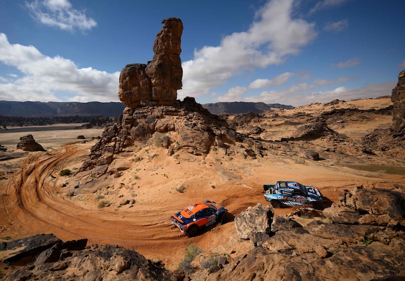 French driver Lionel Baud and co-driver Remi Boulanger ride ahead of Spanish driver Carlos Checa and co-driver Marc Sola Terradellas during the fourth stage of the 2023 Dakar rally around Ha'il in Saudi Arabia on January 4, 2023.  (Photo by FRANCK FIFE  /  AFP)