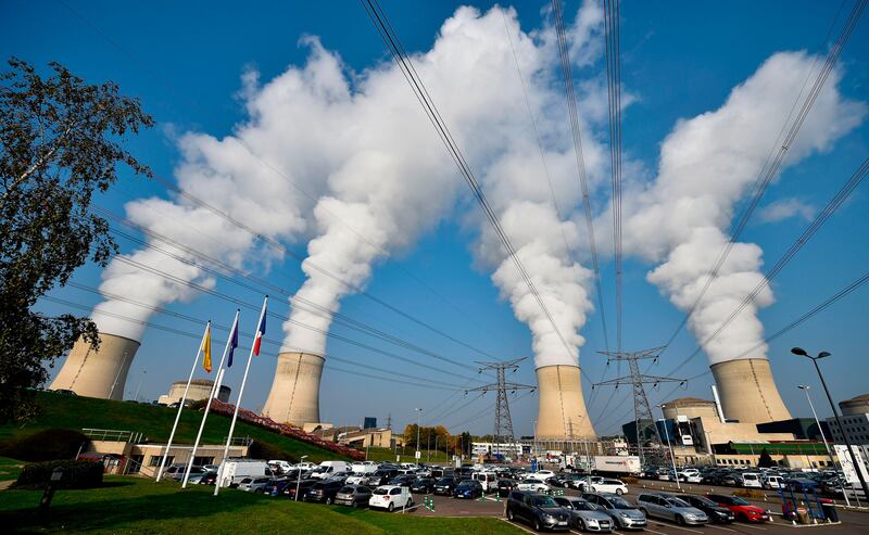 TOPSHOT - This general view shows the chimmneys of the nuclear power plant at Cattenom in eastern France on October 17, 2017. 
 / AFP PHOTO / JEAN-CHRISTOPHE VERHAEGEN