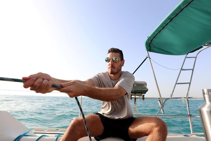 Dubai, United Arab Emirates - May 14, 2019: Matt Stone takes part in the Dubai offshore sailing club pursuit race. Tuesday the 14th of May 2019. Dubai. Chris Whiteoak / The National