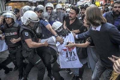 Turkish police officers arrest protesters, gathered in support of workers that were arrested earlier for protesting over labour conditions at Istanbul's new airport, in Istanbul, on September 15, 2018. A trade union leader says police rounded up more than 500 construction workers after they staged a protest at the new airport. AFP