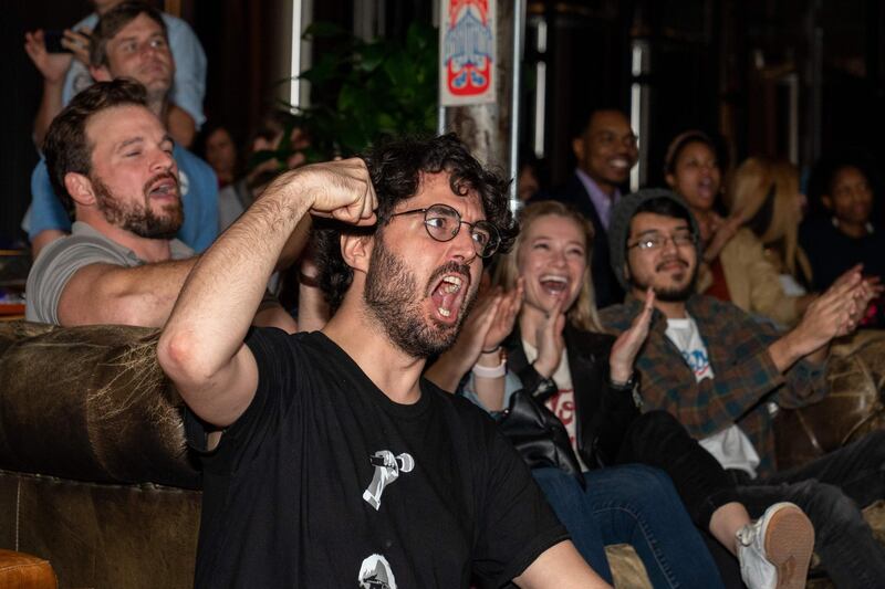 Supporters of Democratic presidential candidate Vermont Senator Bernie Sanders cheer as they hear election results during a watch party held at Central Machine Works Brewery in Austin, Texas on Super Tuesday.  AFP