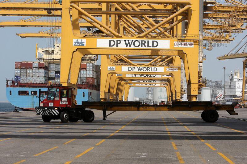 
DUBAI , UNITED ARAB EMIRATES Ð Oct 06 : Gantries loading the cargo containers on the trucks at the Terminal 1 in Jebel Ali port in Dubai. ( Pawan Singh / The National ) For Business. Story by Frank Kane