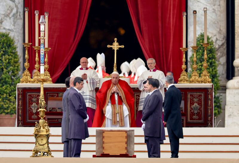 Pallbearers stand next to the coffin. Reuters