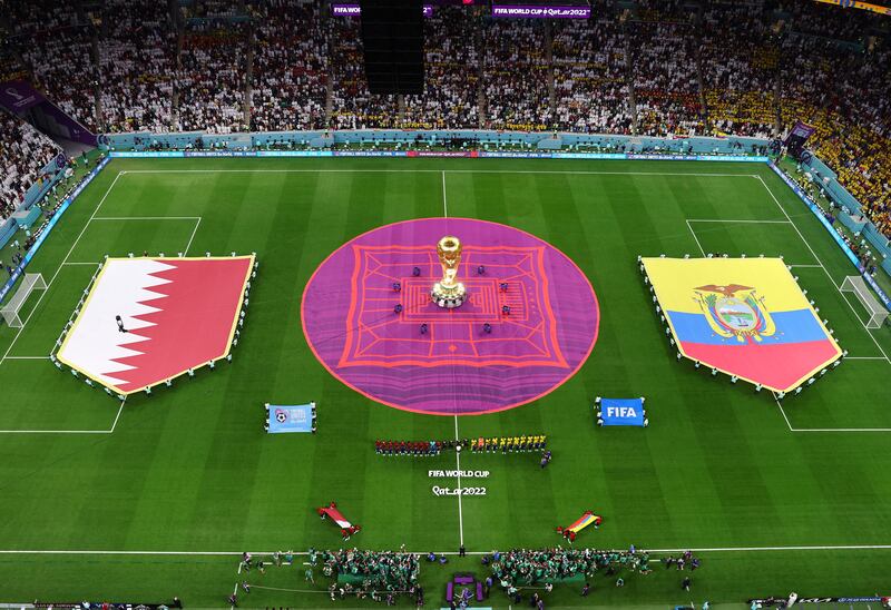 General view of a giant replica World Cup trophy inside the stadium before the match. Reuters