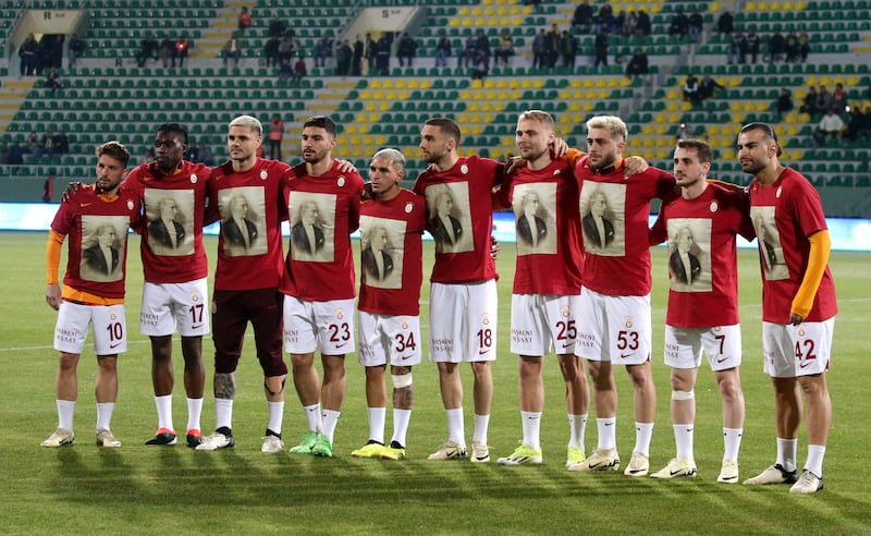Galatasaray players line up before the match wearing shirts with the image of Turkey's founder Mustafa Kemal Ataturk. Reuters