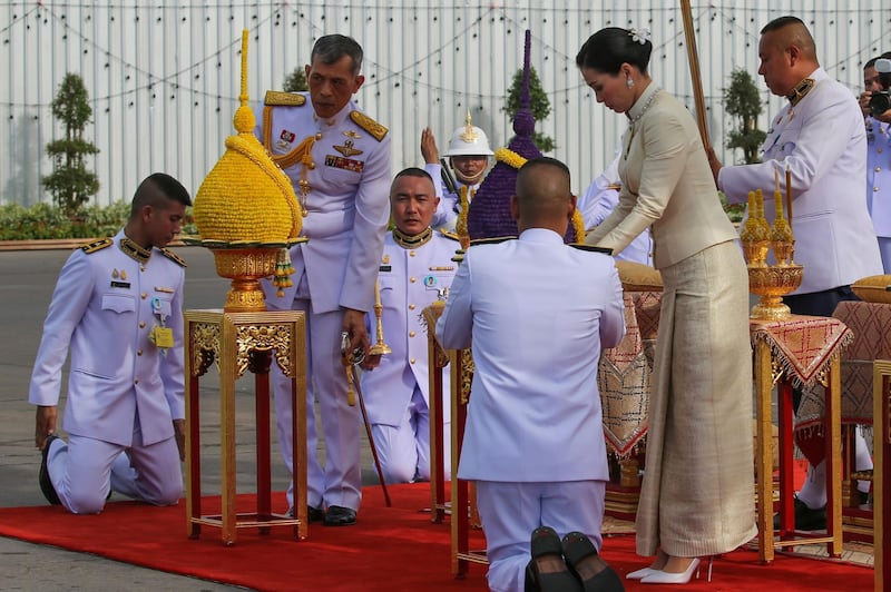 Thailand's King Maha Vajiralongkorn (2nd L) and Queen Suthida (2nd R) pay their respect at King Rama V. AFP