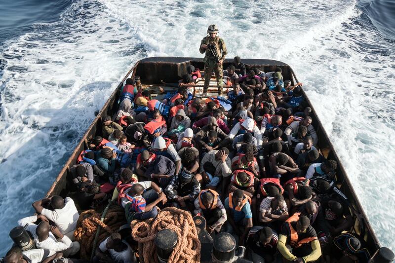 A Libyan coast guardsman stands on a boat during the rescue of 147 illegal immigrants attempting to reach Europe off the coastal town of Zawiyah, 45 kilometres west of the capital Tripoli, on June 27, 2017. Taha Jawashi / AFP