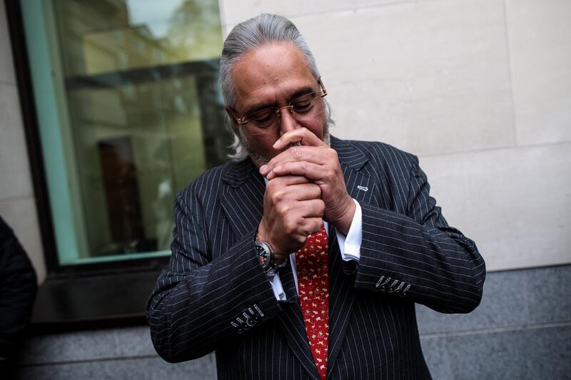 LONDON, ENGLAND - DECEMBER 10: Indian businessman Vijay Mallya smokes during a break in his extradition ruling at Westminster Magistrates Court on December 10, 2018 in London, England. India is seeking to extradite Mr Mallya from Britain to face criminal action over loans taken out by his defunct Kingfisher Airlines and debts amounting to £1.1 billion pounds, which Indian authorities say Kingfisher owes. (Photo by Jack Taylor/Getty Images)