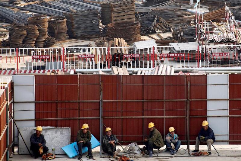 Workers rest at the construction site of the terminal for the Beijing New Airport in Beijing's southern Daxing District, China October 10, 2016. REUTERS/Thomas Peter
