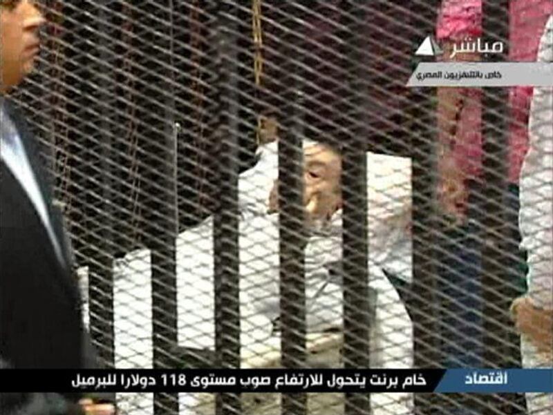 Former Egyptian President Hosni Mubarak is seen on a hospital bed in the courtroom for his trial at the Police Academy in Cairo in this still image taken from video August 3, 2011. Egypt's Hosni Mubarak was shown wheeled into a cage in court in Cairo on Wednesday with his two sons and other defendants to stand trial for his role in the killing of protesters, state television images showed. REUTERS/Egypt TV via Reuters TV (EGYPT - Tags: CRIME LAW POLITICS CIVIL UNREST) FOR EDITORIAL USE ONLY. NOT FOR SALE FOR MARKETING OR ADVERTISING CAMPAIGNS. THIS IMAGE HAS BEEN SUPPLIED BY A THIRD PARTY. IT IS DISTRIBUTED, EXACTLY AS RECEIVED BY REUTERS, AS A SERVICE TO CLIENTS. EGYPT OUT. NO COMMERCIAL OR EDITORIAL SALES IN EGYPT *** Local Caption ***  LONX110_EGYPT-MUBAR_0803_11.JPG