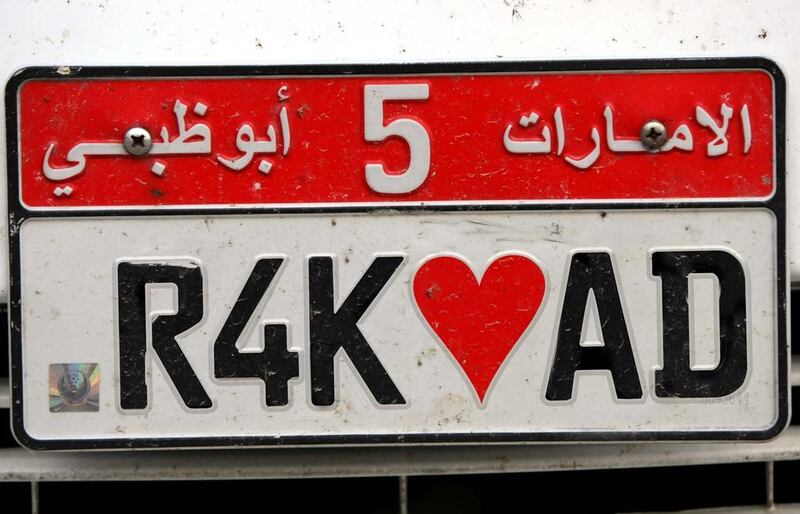 The red of this Abu Dhabi license plate is an in-demand shade among the northern emirates' young drivers. Stephen Lock / The National