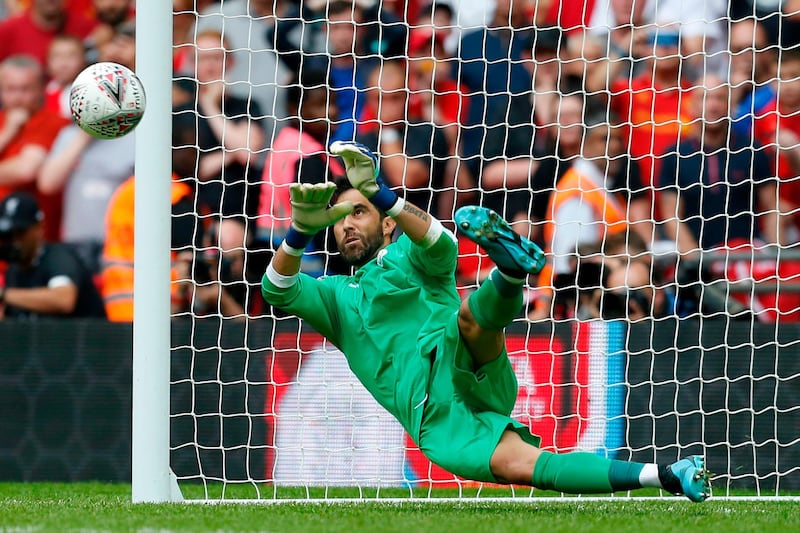 Manchester City's Chilean goalkeeper Claudio Bravo saves a penalty from Liverpool's Dutch midfielder Georginio Wijnaldum in the shoot-out during the English FA Community Shield football match between Manchester City and Liverpool at Wembley Stadium in north London on August 4, 2019. Manchester City won the game 5-4 on penalties after the game finished 1-1. - NOT FOR MARKETING OR ADVERTISING USE / RESTRICTED TO EDITORIAL USE
 / AFP / Ian KINGTON / NOT FOR MARKETING OR ADVERTISING USE / RESTRICTED TO EDITORIAL USE
