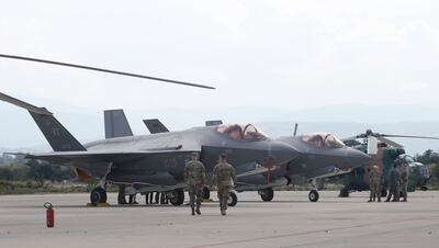 US military officers walk next to F-35 fighter jets in the military base at Skopje Airport, North Macedonia, last June. AP Photo 