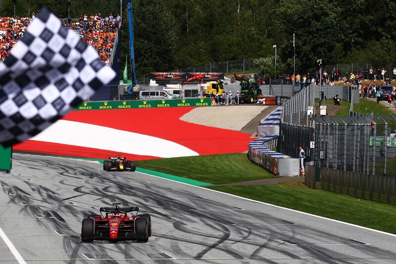 Race winner Charles Leclerc takes the chequered flag at the end of the Austrian Grand Prix. Getty