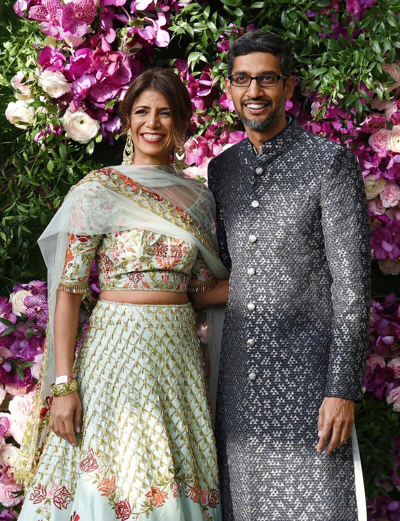 Indian businessman and Google CEO Sundar Pichai (R) poses for photographs with his wife and engineer Anjali Pichai. Photo: AFP
