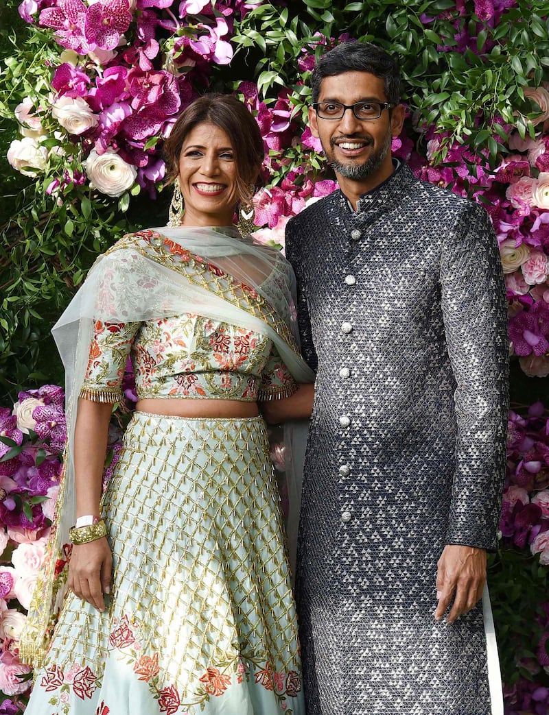 Indian businessman and Google CEO Sundar Pichai (R) poses for photographs with his wife and engineer Anjali Pichai. Photo: AFP