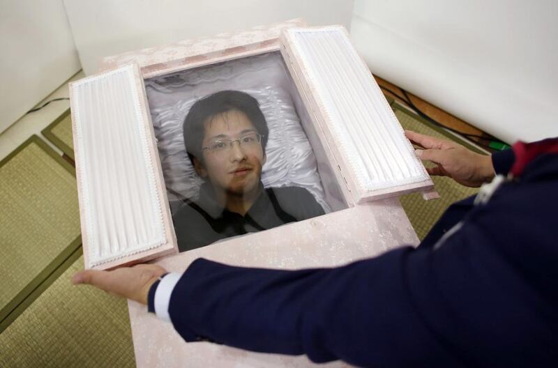 Noriaki Iwashima looks out of a coffin during an end-of-life seminar held by Japan’s largest retailer Aeon Co in Tokyo. Funeral arrangements are normally left to those who have been left behind but the latest trend in Japan, which literally translates to “End of life” preparations, is for the ageing to prepare their own funerals and graves before they set off on their journey to the great beyond. Reuters
