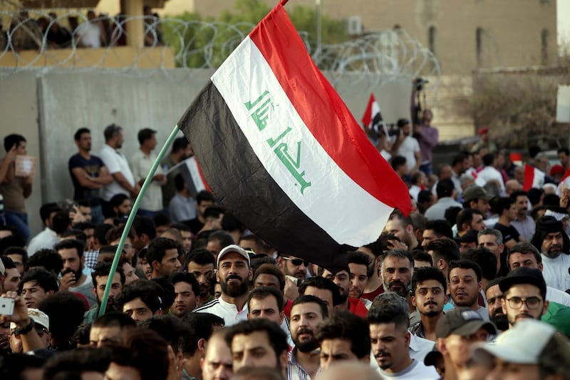 epa06914626 Iraqis chant slogans and carry banners during a demonstration in front of the headquarter of Basra governorate in Basra, 500 km southern Iraq, 27 July 2018.  According to media reports thousands of Iraqis protesters continue to hold protests in Baghdad and other provinces against unemployment, the rising cost of living, and lack of basic services.  EPA/HAIDER AL-ASSADEE