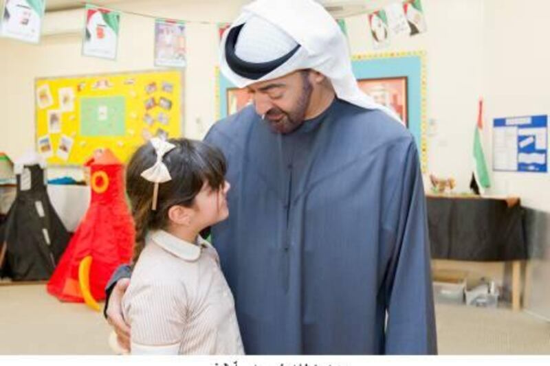 ABU DHABI, UNITED ARAB EMIRATES - December 8, 2011:  HH General Sheikh Mohamed bin Zayed Al Nahyan Crown Prince of Abu Dhabi Deputy Supreme Commander of the UAE Armed Forces, visits Alyazia, 9, at Al Muna Primary School. 
( Ryan Carter / Crown Prince Court - Abu Dhabi ) *** Local Caption ***  114a1bfd-c8a9-43bd-a080-dd8d891241fc.jpg