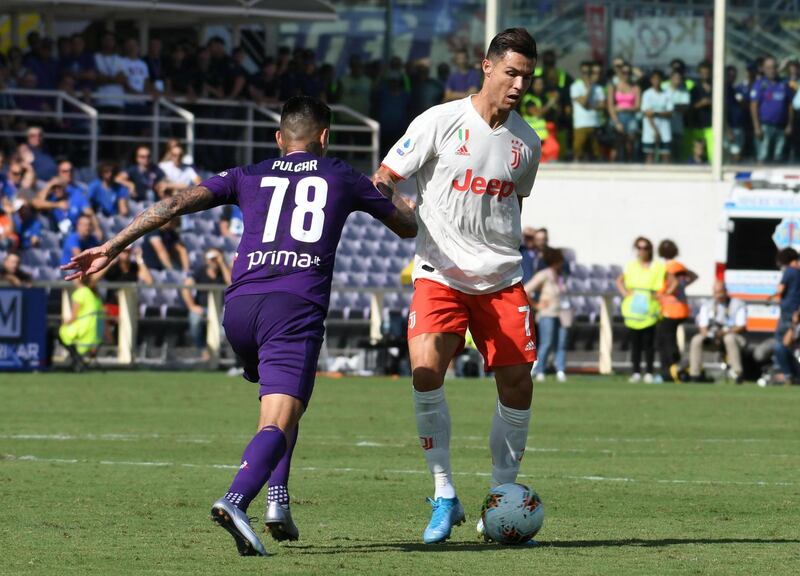 Fiorentina's Erick Pulgar in action against Juventus' Cristiano Ronaldo. EPA