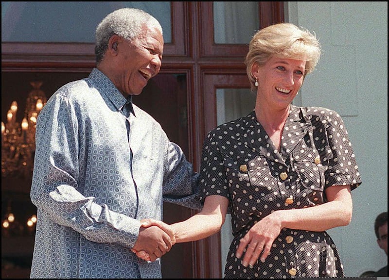 South African President Nelson Mandela and Princess Diana speak with the press after meeting in Cape Town, South Africa, in 1997. AFP