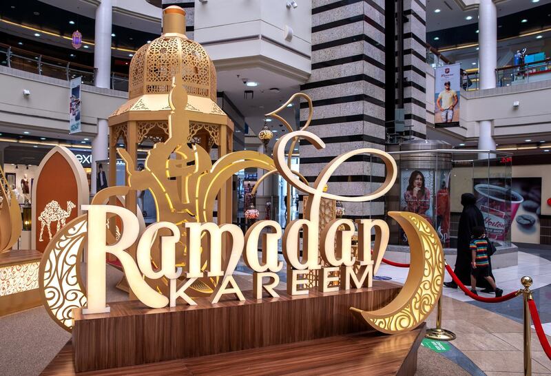 Abu Dhabi, United Arab Emirates, April 17, 2021.   Al Wahda Mall Ramadan decor.  Mall goers enjoy the Ramadan lanters exhibition at the main lobby of the mall.
Victor Besa/The National
Section:  NA/Stand Alone/Stock Images