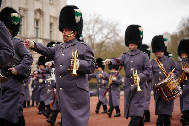 The Band of the Welsh Guards marches at Buckingham Palace to mark the anniversary. PA