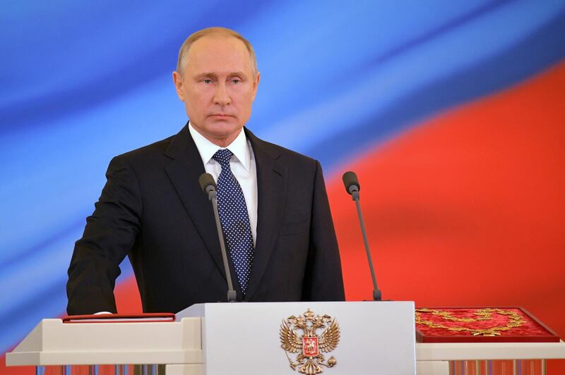 Vladimir Putin swears oath during an inauguration ceremony in the Kremlin, in Moscow. Alexander Astafyev / EPA