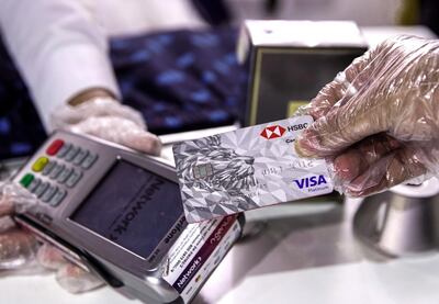 Abu Dhabi, United Arab Emirates, May 18, 2020.    
Cashless payments at the Al Raha Mall on the first day of reopening during the Covid-19 pandemic.
Victor Besa / The National
Section:  NA
Reporter: