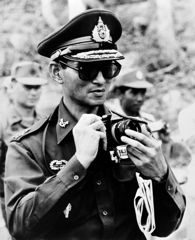 The Thai King taking a picture during his trip to Cambodia on July 7, 1980. Panasia/AFP