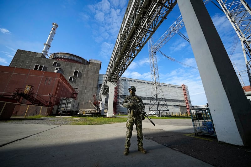 A Russian serviceman guards an area of the Zaporizhzhia nuclear power station. AP