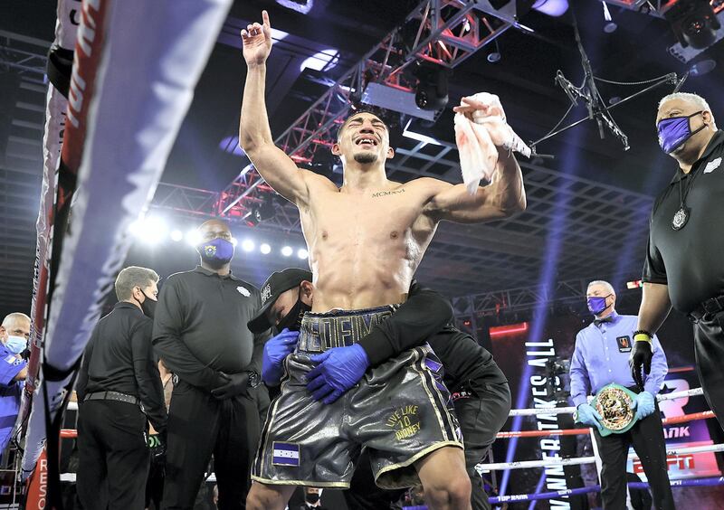 LAS VEGAS, NEVADA - OCTOBER 17: In this handout image provided by Top Rank, Teofimo Lopez Jr celebrates after defeating Vasiliy Lomachenko (not pictured) in their Lightweight World Title bout at MGM Grand Las Vegas Conference Center on October 17, 2020 in Las Vegas, Nevada. (Photo by Mikey Williams/Top Rank via Getty Images)